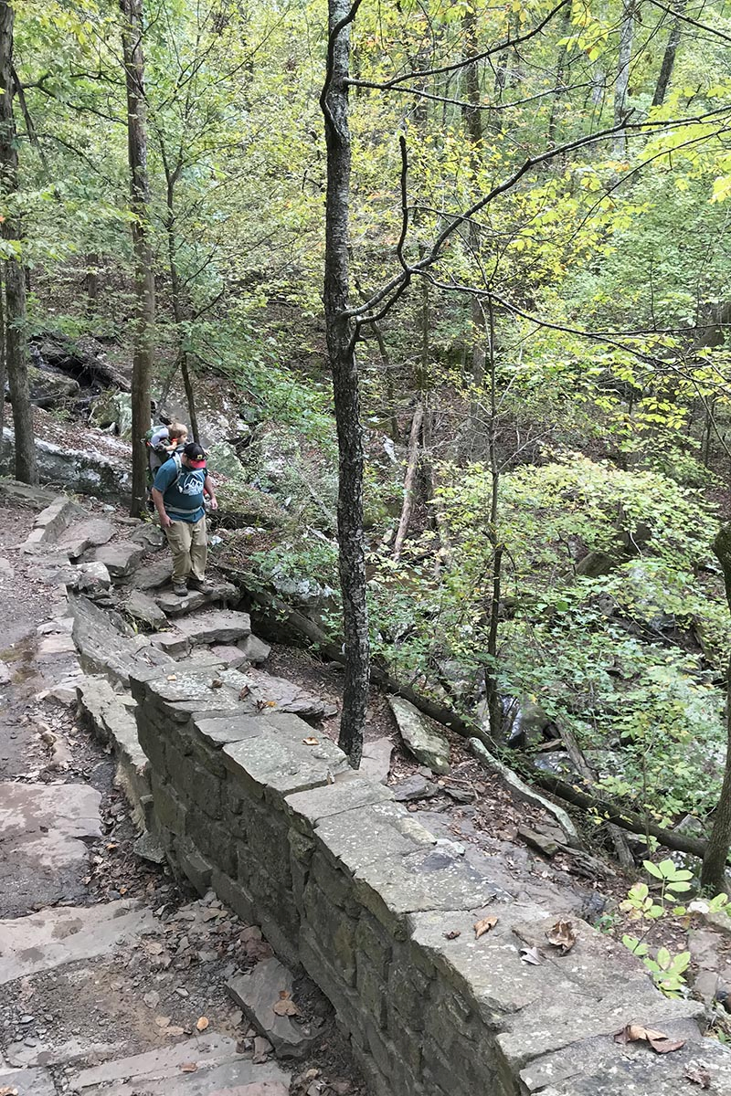 hiking down the main descent on Cedar Falls Trail in Petit Jean State Park in the Natural State