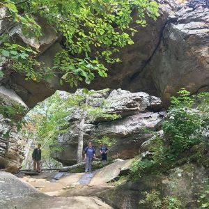 mom and sons at Natural Bridge on Seven Hollows Trail in Petit Jean State Park