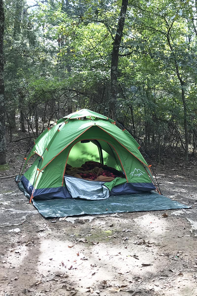 green camping tent on ground at Petit Jean State Park