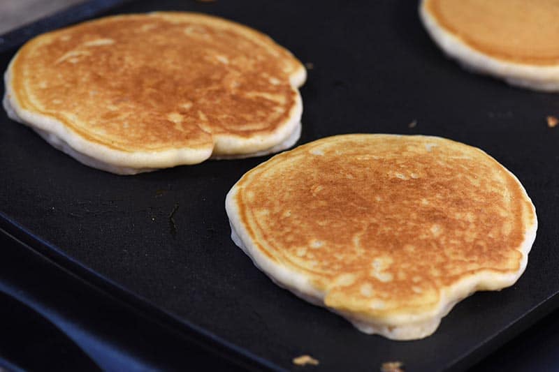 cooking pancakes from scratch on the griddle, using a butterbeer pancake recipe