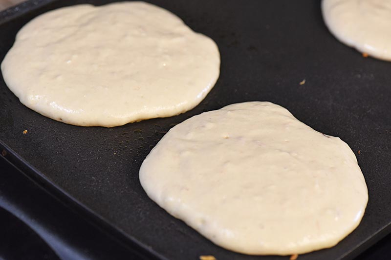 cooking pancakes on griddle, using a butterbeer pancake recipe