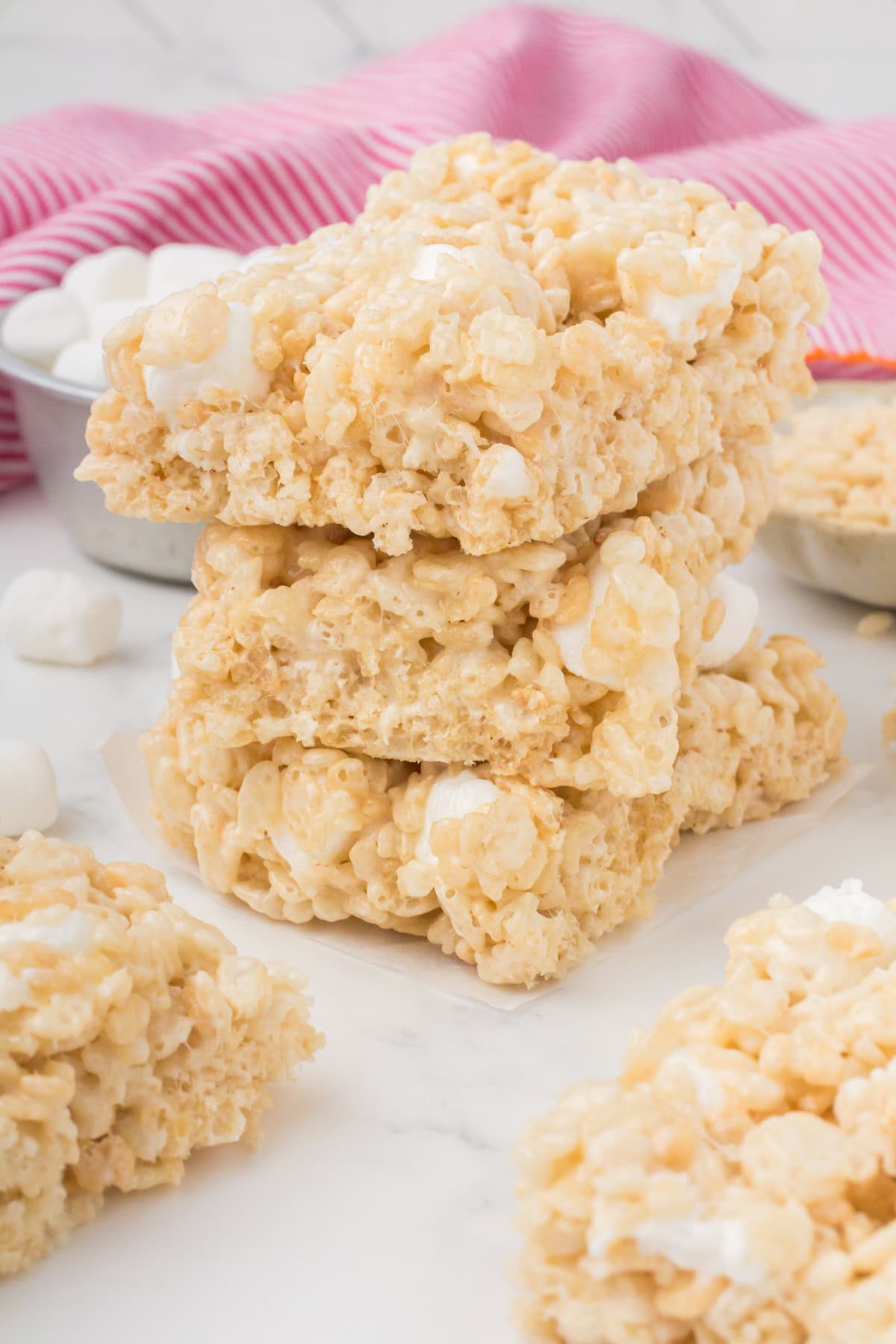stack of marshmallow Rice Krispie treats on a white countertop