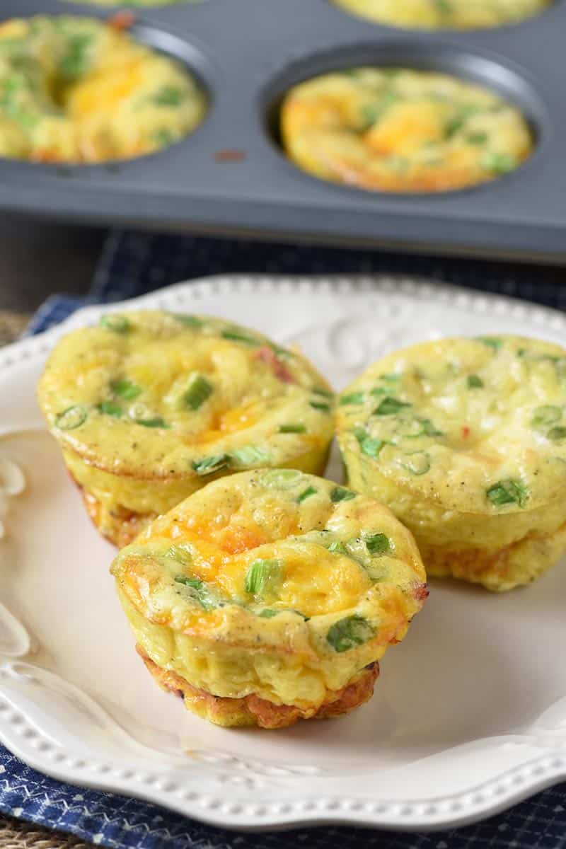 ham and eggs breakfast muffins on white plate