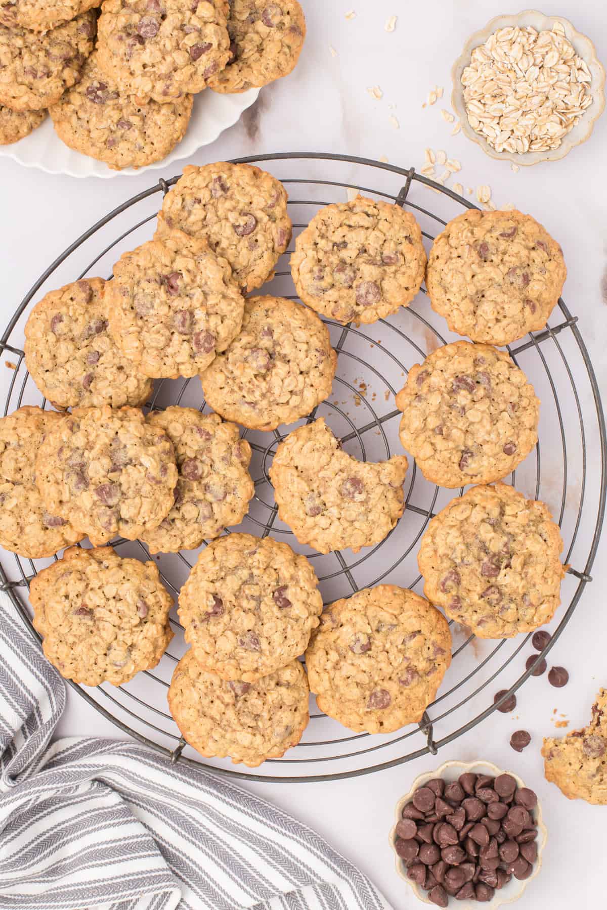 oatmeal cookies with chocolate chips fresh out of the oven cooling on a wire cooling rack