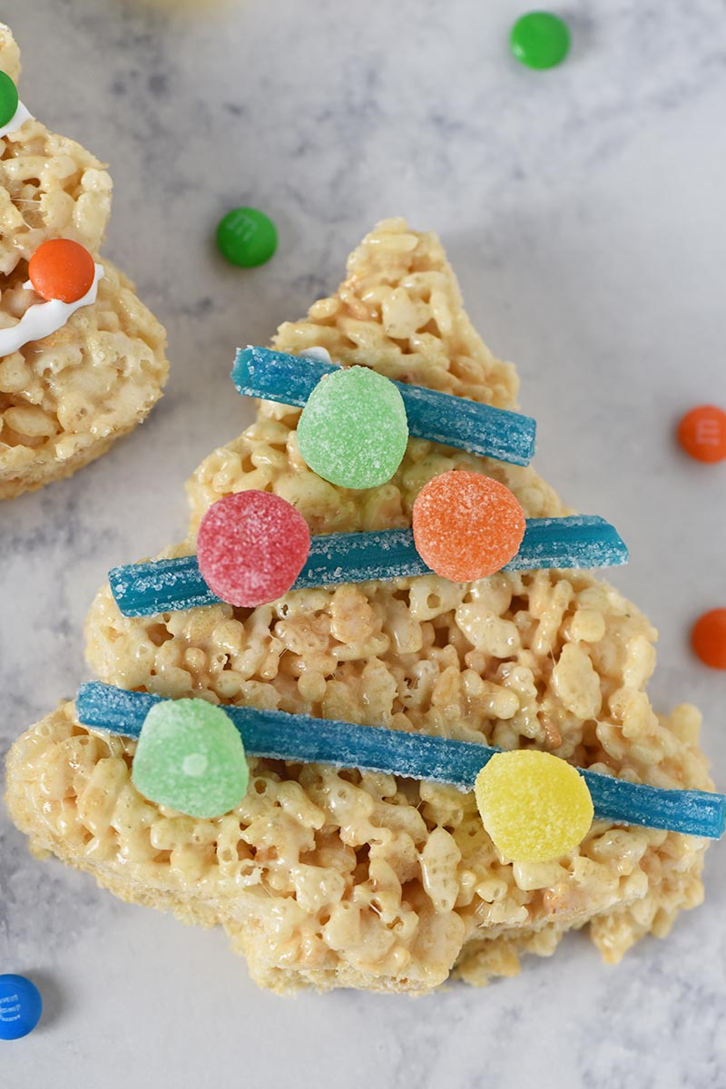 sour straws used as tinsel with spice drop ornaments on Rice Krispie Christmas trees