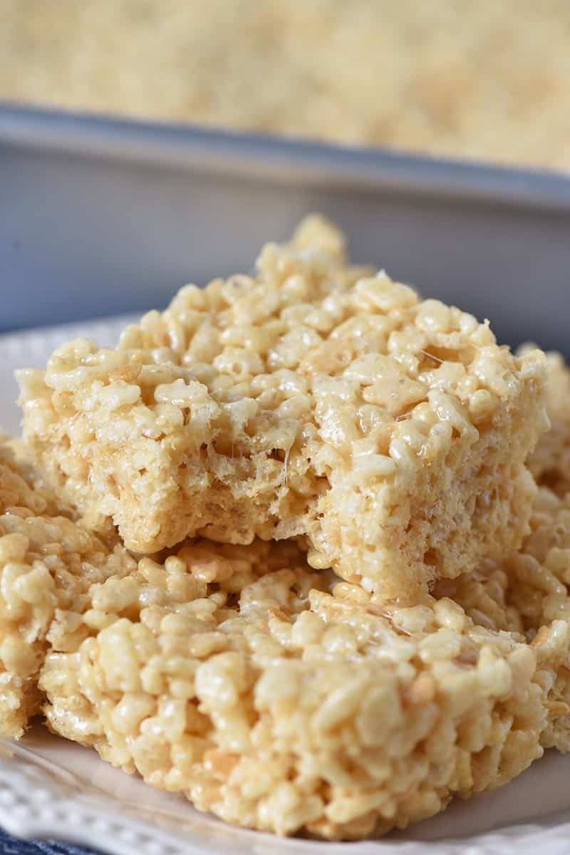Rice Krispie squares stacked on white plate