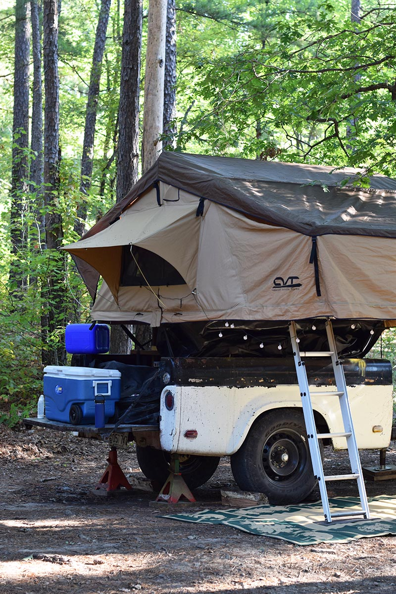 roof top tent setup on camp trailer with jacks