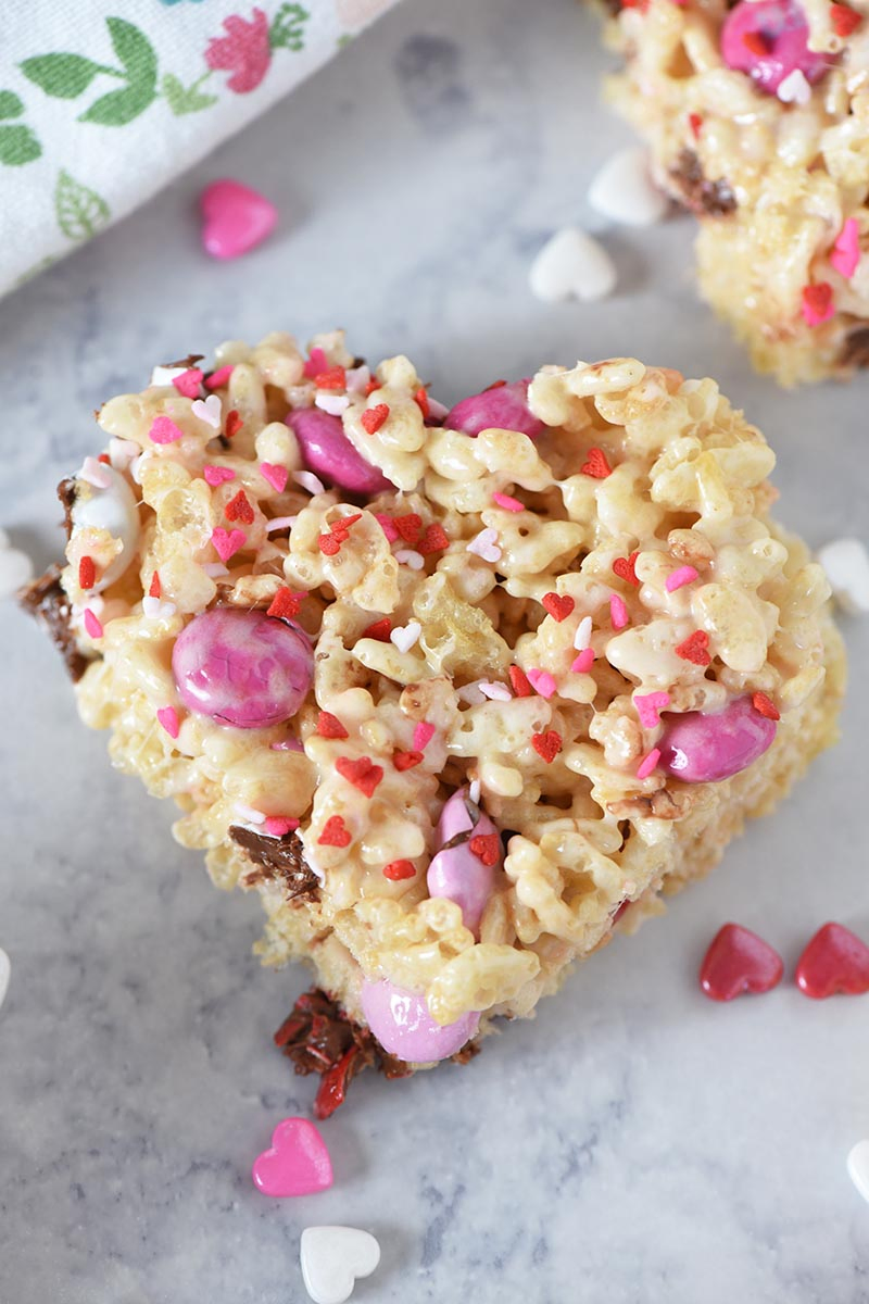 heart shaped M&M's Rice Krispie treats with heart sprinkles for Valentine's Day