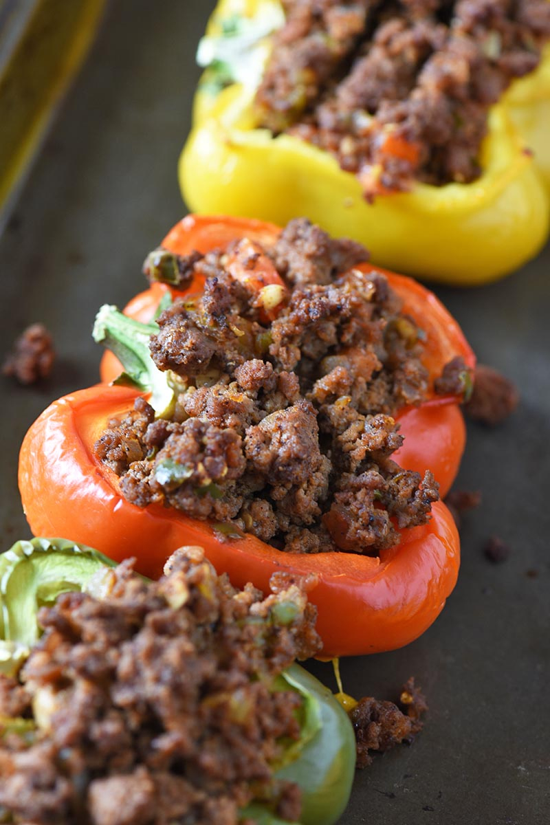 colorful Mexican stuffed peppers on baking sheet