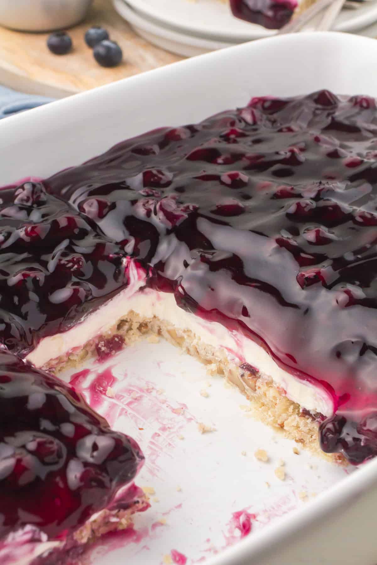 blueberry lush layered dessert in a white baking dish