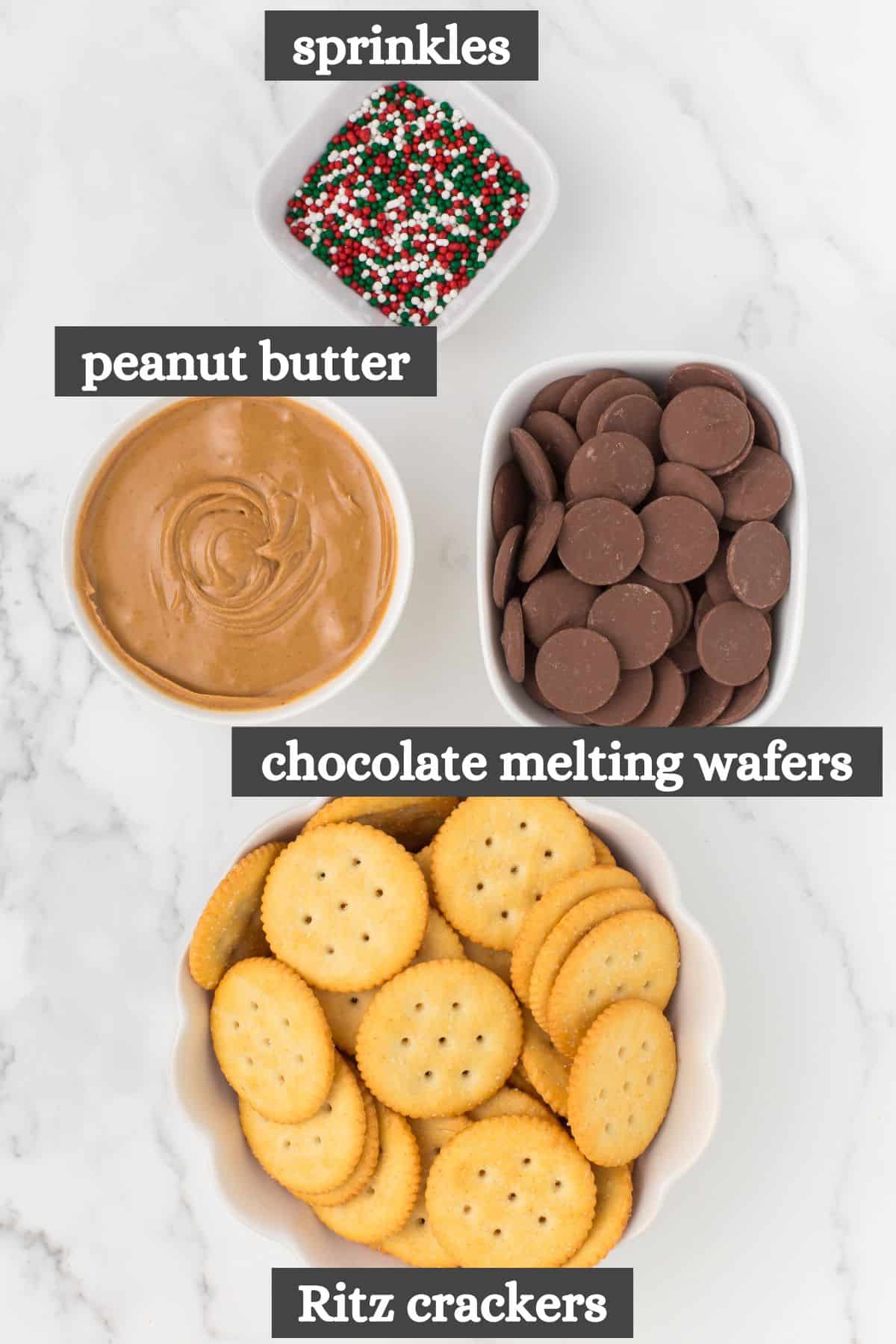 Chocolate covered RItz crackers with peanut butter ingredients lined out on a white countertop