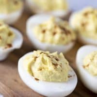 easy deviled eggs on wood cutting board