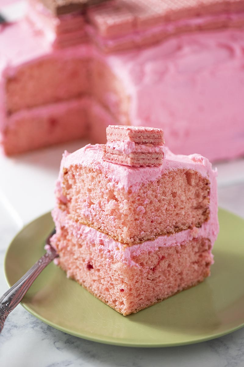 slice of pink pig Minecraft cake on green plate
