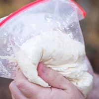 making easy pizza dough in a Ziploc bag for campfire pizza