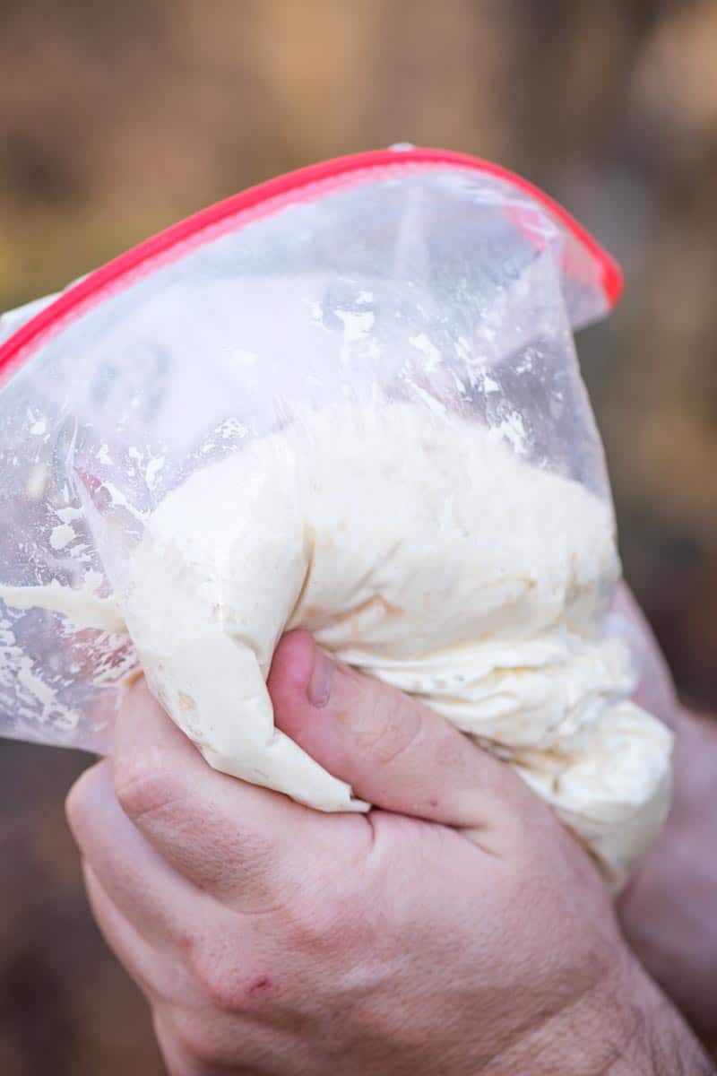 making easy pizza dough in a Ziploc bag for campfire pizza