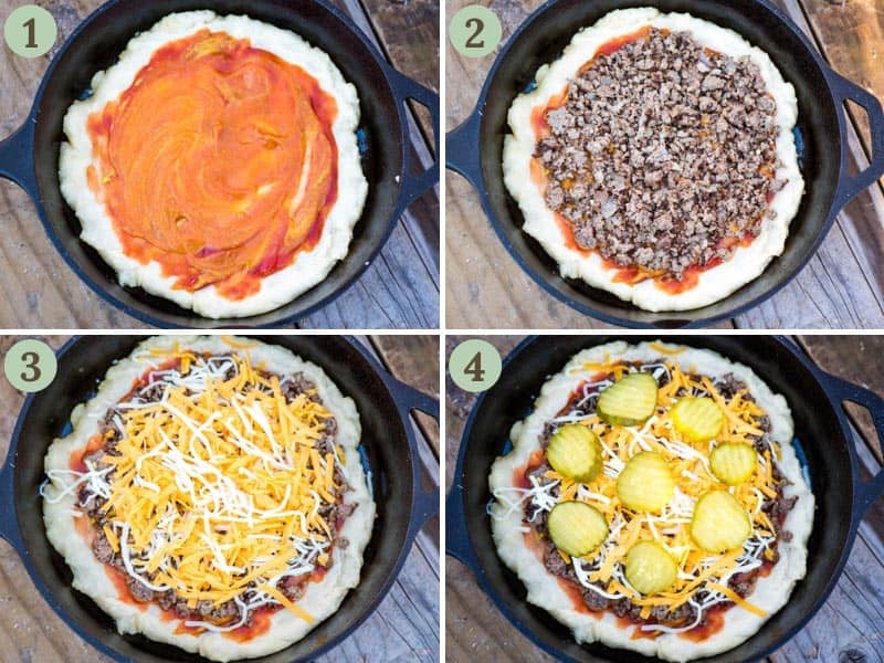making cast iron pizza by layering ketchup, mustard, cooked ground beef, cheese, and dill pickles onto pizza crust in cast iron skillet