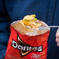 bite of walking taco with Doritos on fork