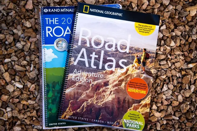 road atlas and adventure road atlas  on rocks