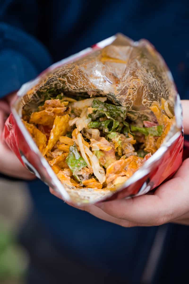 taco in a bag using individual size Doritos chip bag, ground beef, and taco toppings