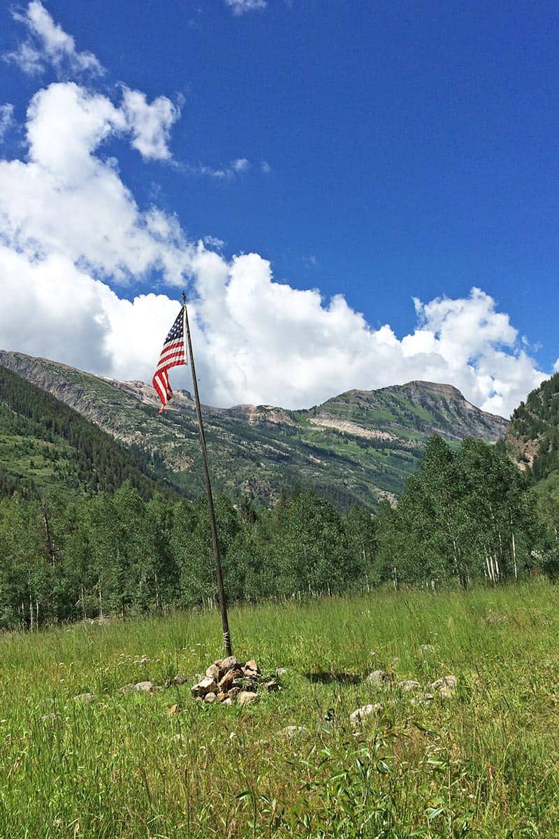 American flag standing tall in the Rocky Mountains in Crystal, Colorado