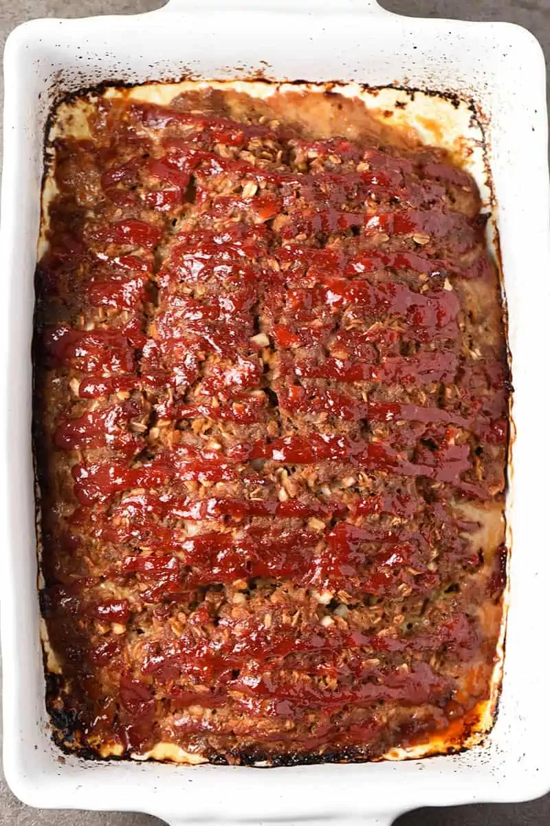 homemade meatloaf in a white baking dish