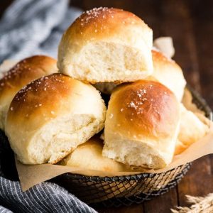 pile of best homemade dinner rolls in bread basket