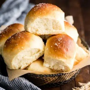 pile of best homemade dinner rolls in bread basket