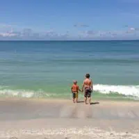 boys standing in water on beach at Captiva Island