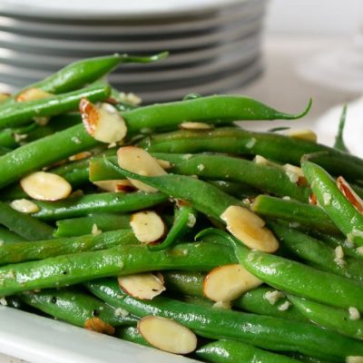 green bean almondine on white plate