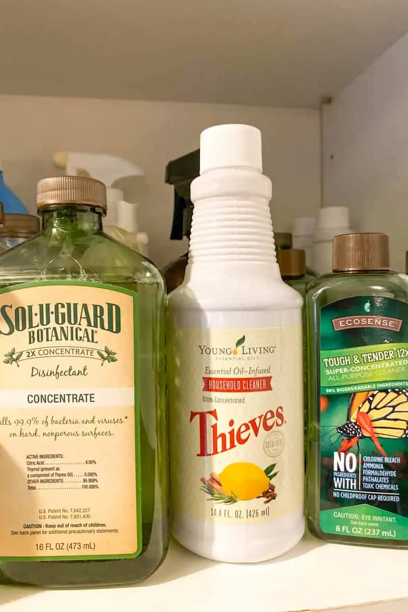 household cleaners from Melaleuca and Young Living in a working pantry, SoluGuard, Thieves Household Cleaner, and Tough & Tender