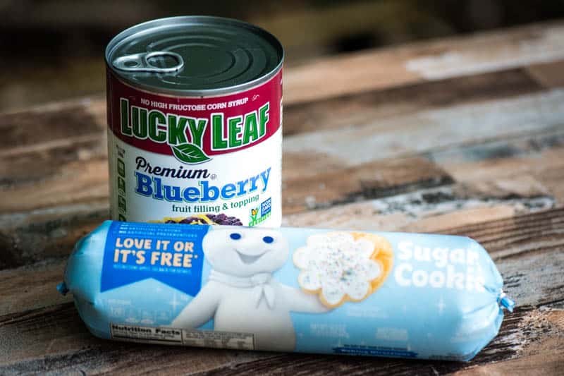 Lucky Leaf blueberry pie filling and roll of Pillsbury sugar cookie dough for campfire blueberry cobbler recipe