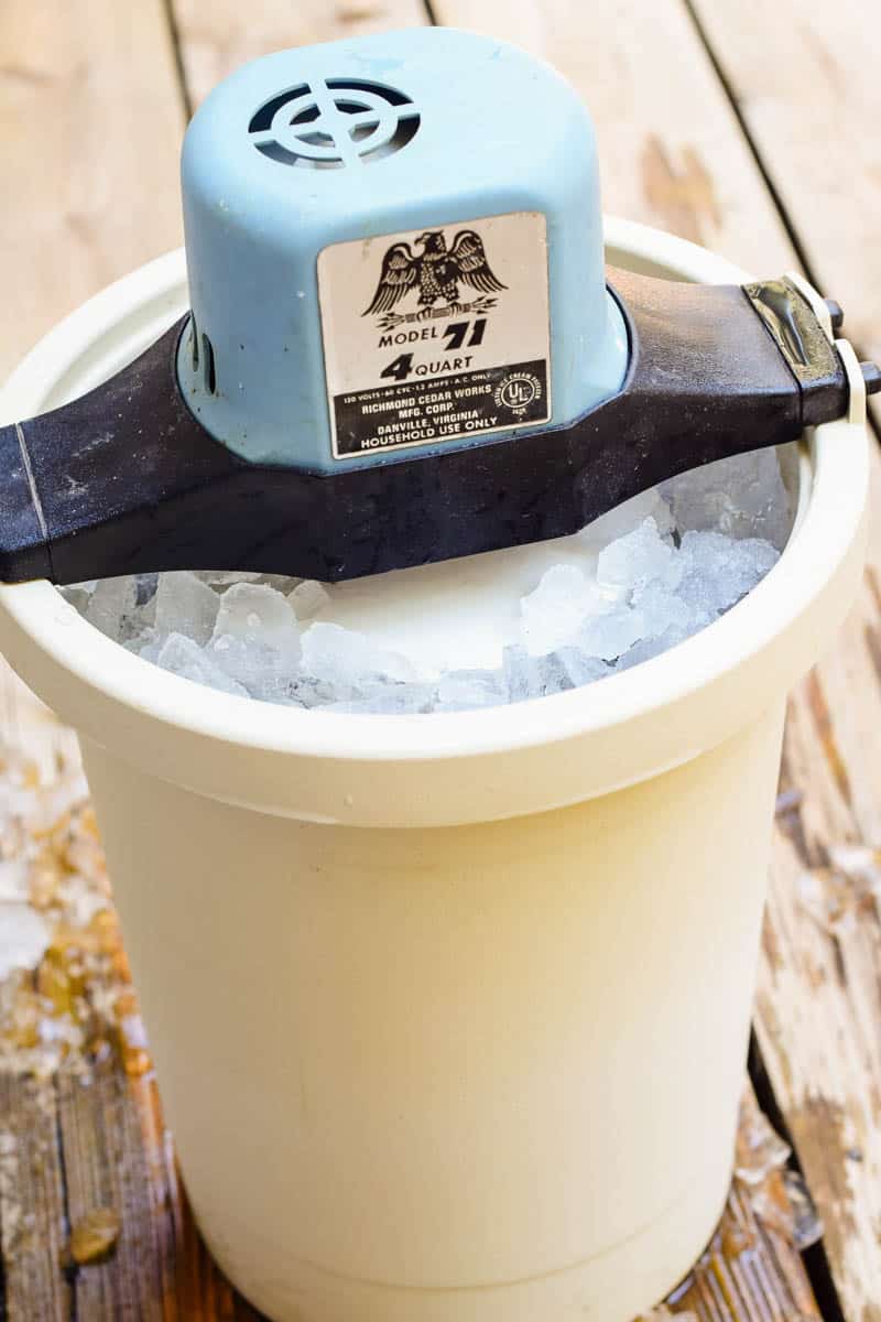 ice cream maker with blue motor, filled with crushed ice