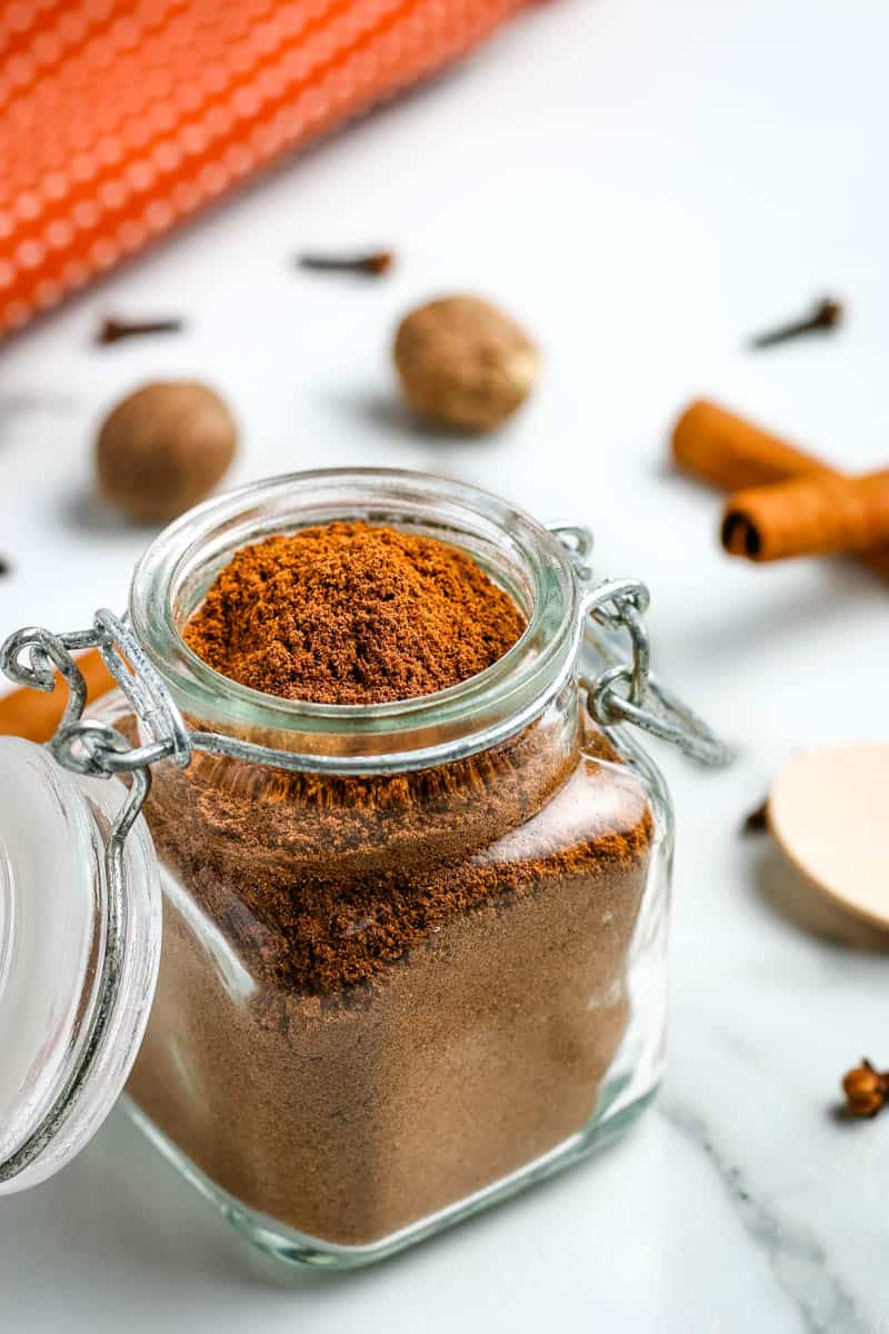 make your own pumpkin pie spice in small glass spice jar with sealable lid and metal clasp