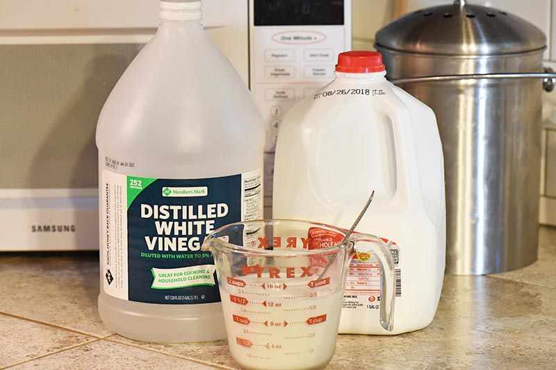 making buttermilk in Pyrex measuring cup with vinegar and milk