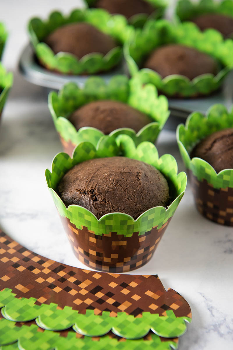 chocolate cupcakes in Minecraft cupcake wrappers on white marble countertop