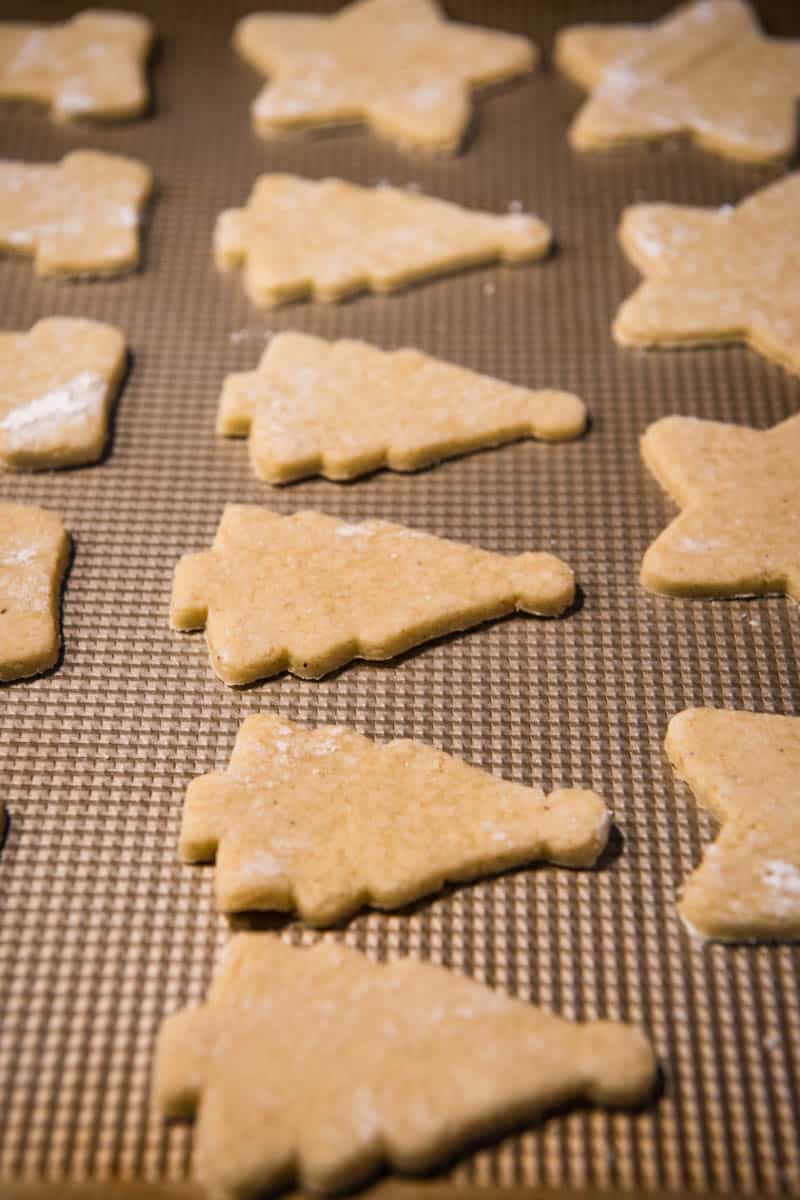 Christmas cut out cookies before baking on cookie sheet