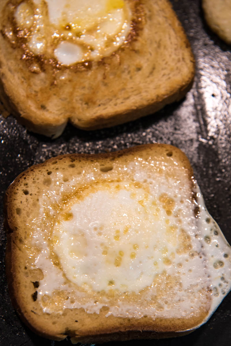 frying eggs in a basket, or eggs on toast, on griddle