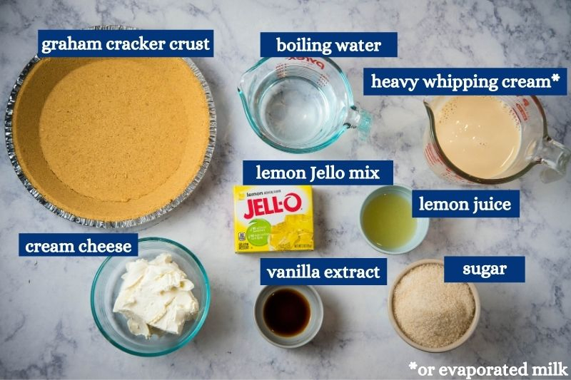 lemon Jello no bake cheesecake ingredients on white marble countertop
