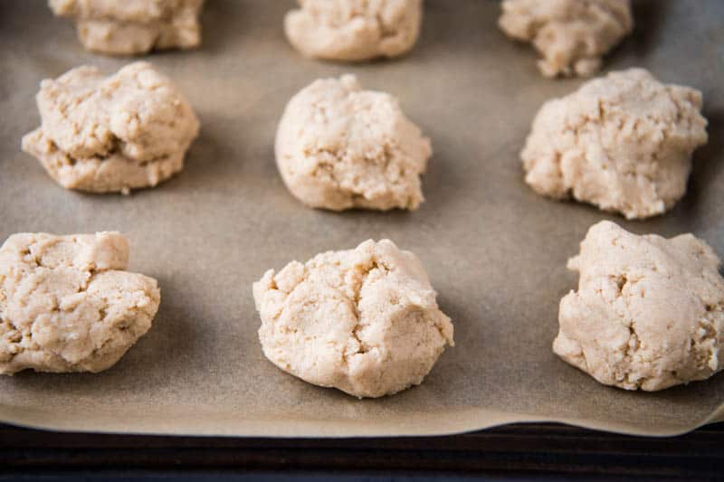 Bisquick drop scones ready to bake on parchment paper covered baking sheet