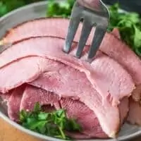 sliced ham on gray plate