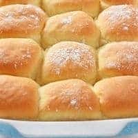 homemade dinner rolls in blue baking dish