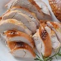 sliced turkey on white platter
