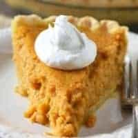 slice of sweet potato pie with whipped cream