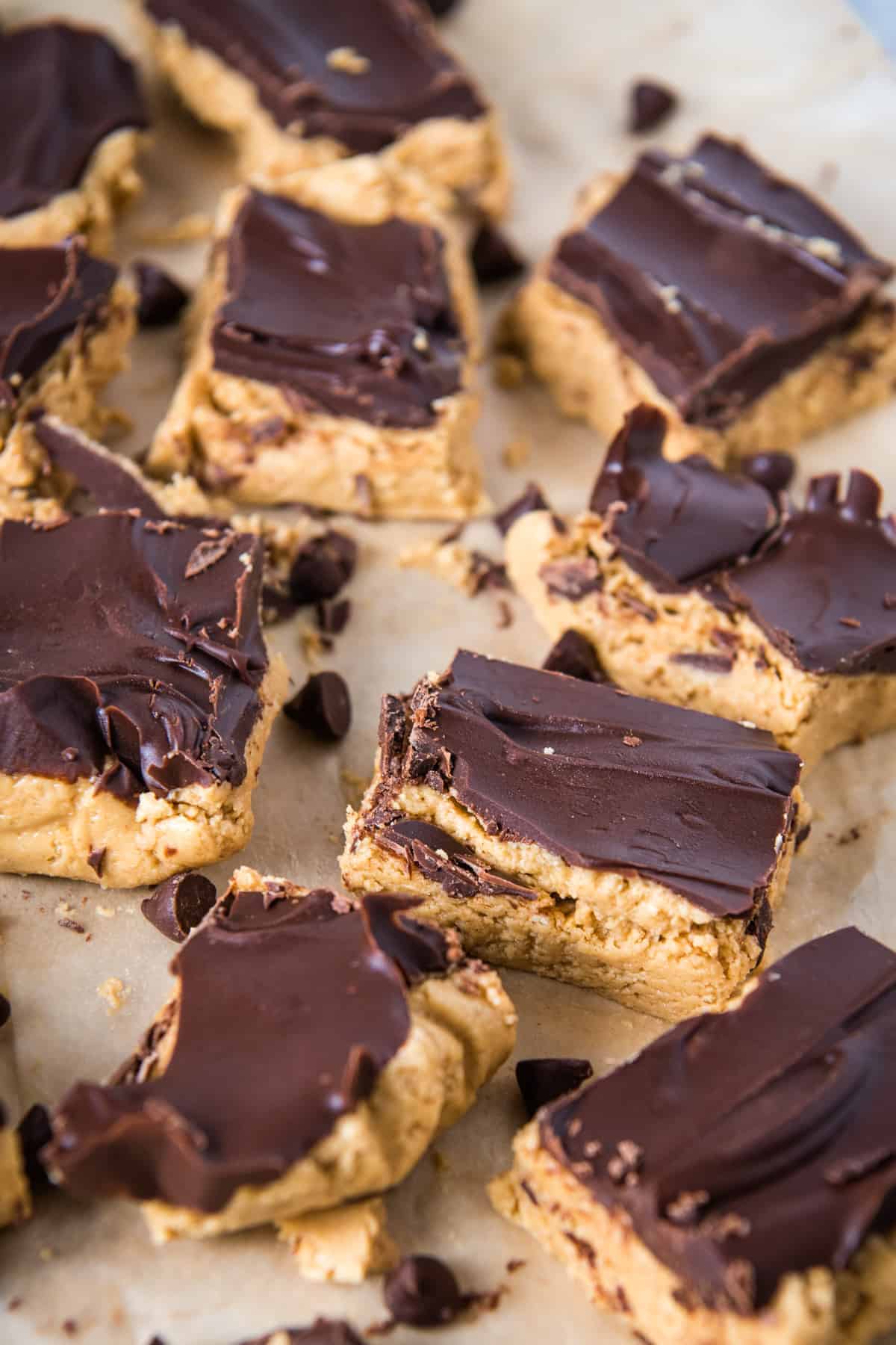 no bake chocolate peanut butter bars on parchment paper