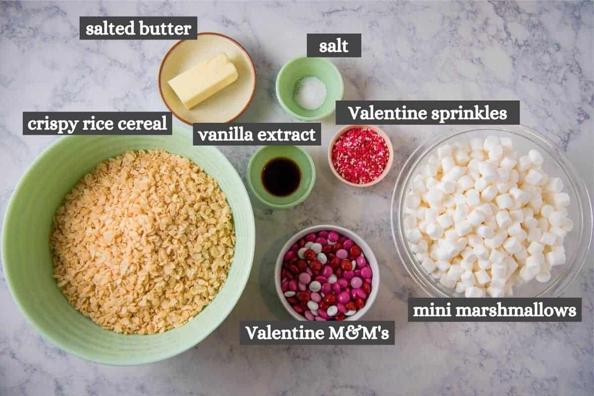 ingredients for Rice Krispie Valentine treats on white marble countertop