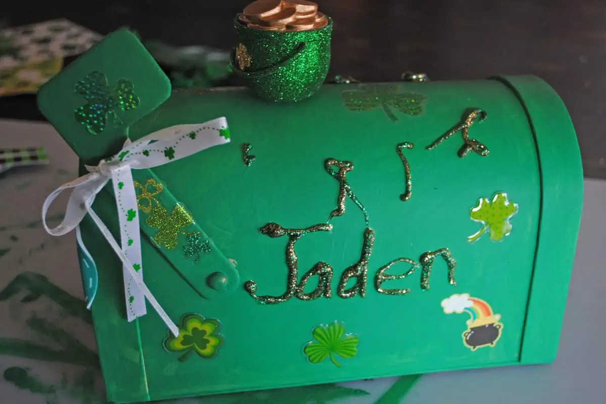 child's name added to leprechaun box with green and gold glitter glue