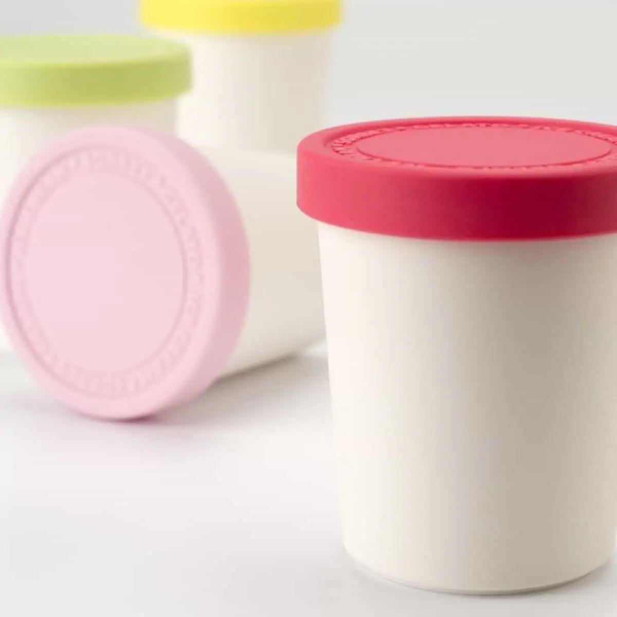 small ice cream storage tubs with colorful lids