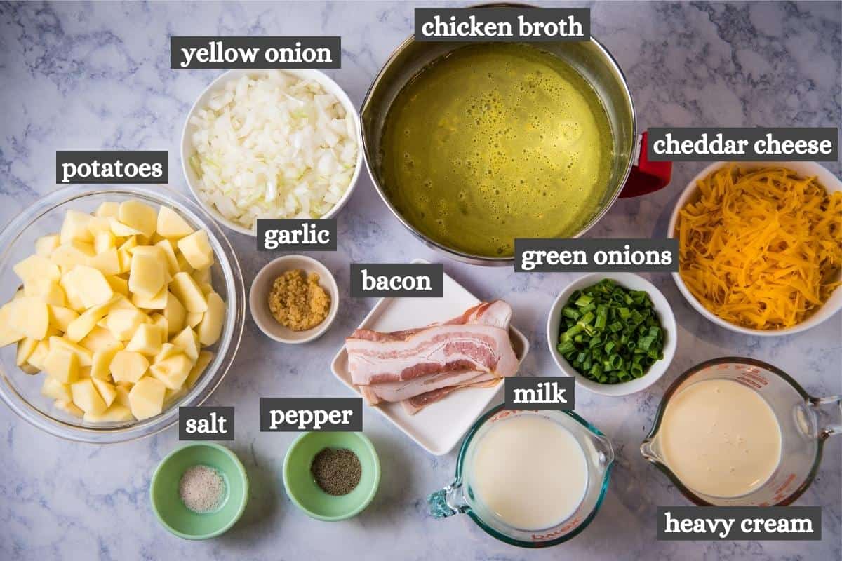 Instant Pot potato soup ingredients in bowls on white marble countertop