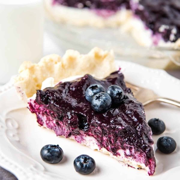 slice of blueberry cream cheese pie on white plate