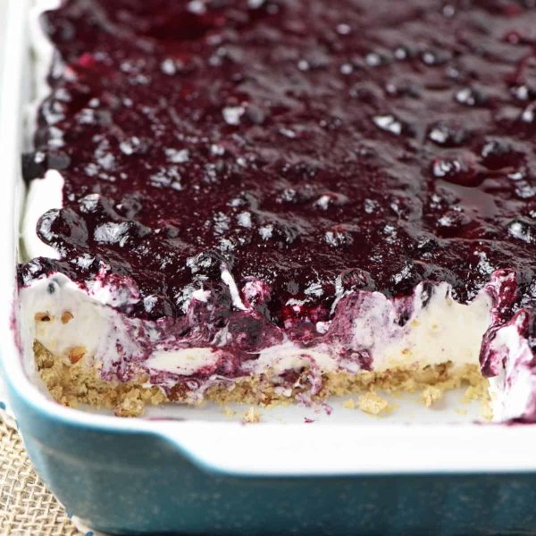 sliced blueberry delight in blue and white baking dish